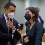 
              Italian Foreign Minister Luigi Di Maio, left, shares a word with German Foreign Minister Annalena Baerbock at a meeting of the EU foreign ministers at the Europa building in Brussels, Monday, Mar. 21, 2022. European foreign ministers are debating how to respond to Russia's invasion of Ukraine. (AP Photo/Olivier Matthys)
            