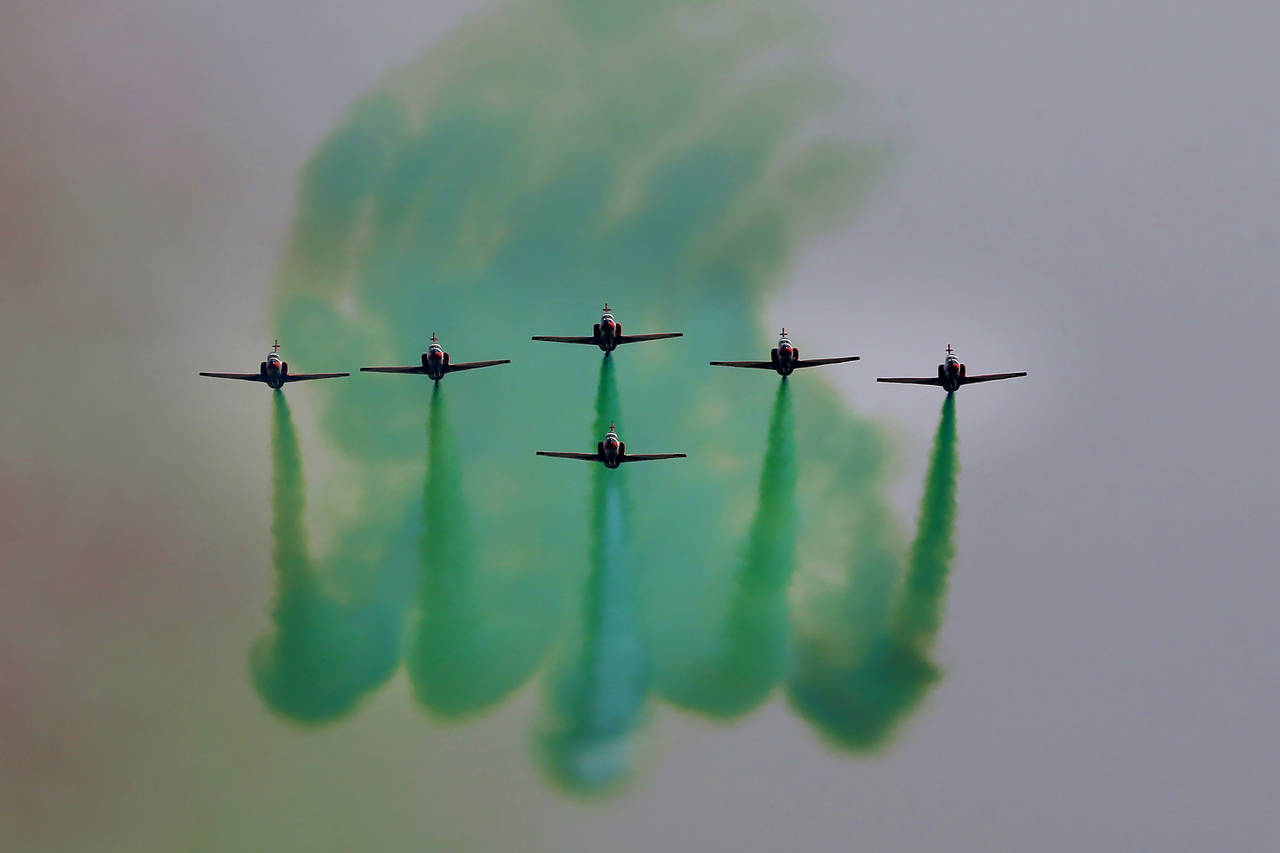 Pakistan Air Force jets demonstrate an aerobatic performance during a military parade to mark Pakis...