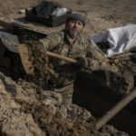 
              A Ukrainian serviceman digs a trench at a position north of the capital Kyiv, Ukraine, Tuesday, March 29, 2022. The first face-to-face talks in two weeks between Russia and Ukraine began Tuesday in Turkey, raising flickering hopes there could be progress toward ending a war that has ground into a bloody campaign of attrition. (AP Photo/Vadim Ghirda)
            