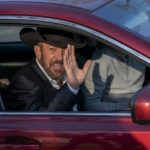 
              Otero County Commissioner Couy Griffin waves from a car as he leaves federal court in Washington, Monday, March. 21, 2022. Griffin is charged with illegally entering Capitol grounds the day a pro-Trump mob disrupted certification of Joe Biden's presidential election victory on Jan. 6, 2021. (AP Photo/Gemunu Amarasinghe)
            