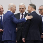 
              President Joe Biden talks with Polish President Andrzej Duda as he arrives at the Presidential Palace, Saturday, March 26, 2022, in Warsaw. (AP Photo/Evan Vucci)
            