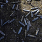 
              Fired bullets are seen under a destroyed Russian tank near the front line in Brovary, on the outskirts of Kyiv, Ukraine, Monday, March 28, 2022. (AP Photo/Rodrigo Abd)
            