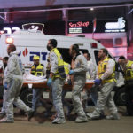 
              Israeli Zaka Rescue and Recovery team carry the body of a victim at the scene of shooting attack In Hadera, Israel, Sunday, March 27, 2022. A pair of gunmen killed two people and wounded four others in a shooting spree in central Israel before they were killed by police, according to police and medical officials. The identity of the gunmen was not immediately known, but police called them "terrorists," the term usually used for Arab assailants. (AP Photo/Ariel Schalit)
            