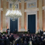 
              Portuguese Prime Minister Antonio Costa, at the lectern, delivers his speech during the swearing in ceremony of the new center-left Socialist government at the Ajuda palace in Lisbon, Wednesday, March 30, 2022. The Socialists captured 120 seats in the 230-seat parliament in a landslide election win last January, opening a path for far-reaching reforms long postponed by political quarreling. (AP Photo/Armando Franca)
            