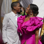 
              Jessica Betts, left, and Niecy Nash arrive at the Oscars on Sunday, March 27, 2022, at the Dolby Theatre in Los Angeles. (AP Photo/John Locher)
            