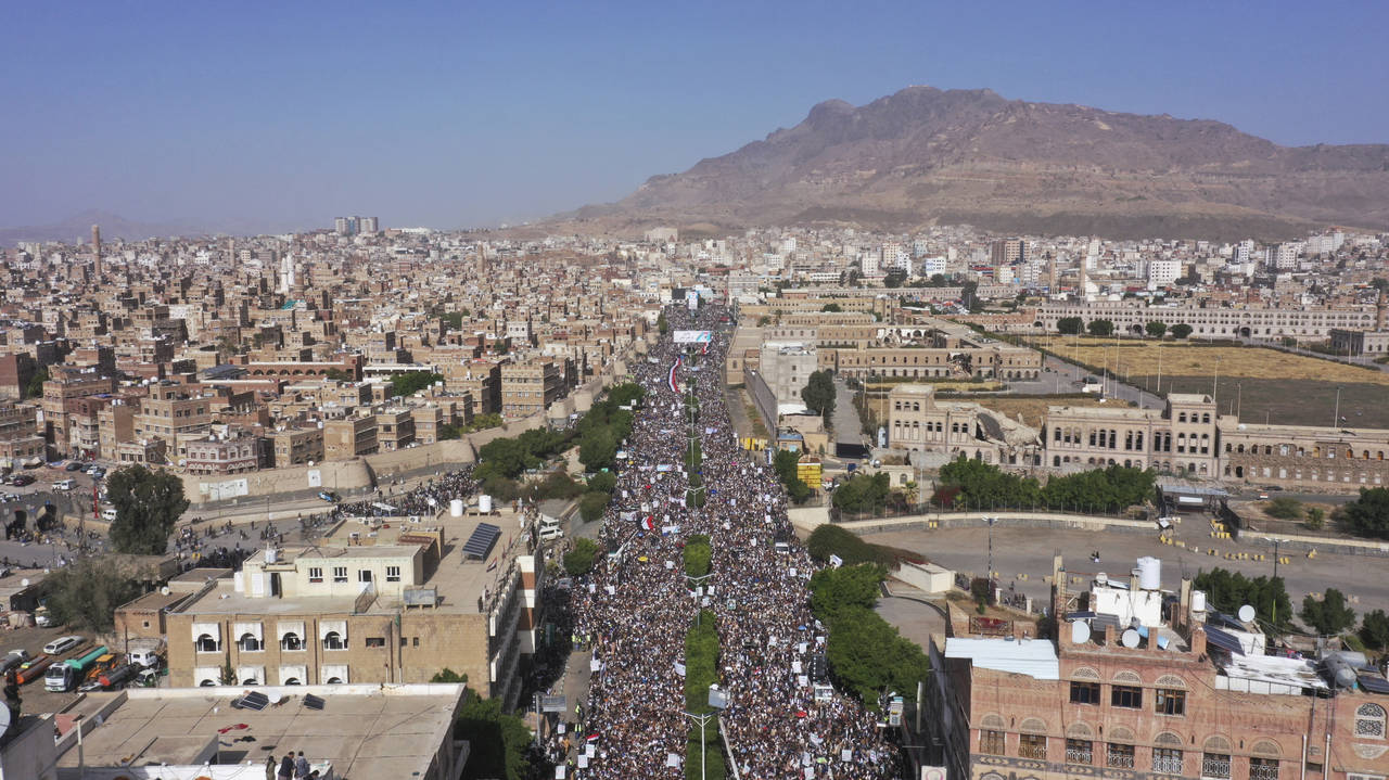 Houthi supporters attend a rally marking the seventh anniversary of the Saudi-led coalition's inter...