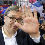 
              Current Serbian President Aleksandar Vucic waves to his supporters during a pre-election rally, in Belgrade, Serbia, Thursday, March 31, 2022. Polls predict that Vucic, who has been boasting his personal ties to Russian President Vladimir Putin, will win another five-year term as president. His his right-wing Serbian Progressive Party is projected to continue to dominate the parliament. But polls also predict a close race in the capital, Belgrade, that could undermine his increasingly autocratic rule. (AP Photo/Darko Vojinovic)
            