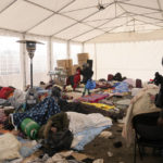 
              People who fled from conflict from Ukraine rest in a tent at the Medyka border crossing, Poland, Tuesday, March 1, 2022. Ambassadors from dozens of countries on Monday backed a proposal demanding that Russia halt its attack on Ukraine, as the U.N. General Assembly held a rare emergency session during a day of frenzied and sometimes fractious diplomacy surrounding the five-day-old war. (AP Photo/Markus Schreiber)
            