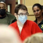 
              Nikolas Cruz enters the courtroom for a hearing at the Broward County Courthouse in Fort Lauderdale, Fla., on Wednesday, March 29, 2022. Cruz previously plead guilty to all 17 counts of premeditated murder and 17 counts of attempted murder in the 2018 shootings at Marjory Stoneman Douglas High School . (Amy Beth Bennett/South Florida Sun-Sentinel via AP, Pool)
            