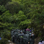 
              Soldiers stand in formation as they preparing to head to the crashed site of the China Eastern Flight 5735, Thursday, March 24, 2022, in Molang village, in southwestern China's Guangxi province. The search area was expanded Thursday in a "blanket search" for the second black box from a China Eastern passenger plane that crashed in southern China with 132 people on board earlier this week, state media said. (AP Photo/Ng Han Guan)
            