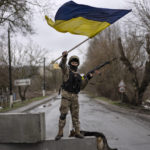 
              A Ukrainian soldier celebrates in a check point in Bucha, in the outskirts of Kyiv, Ukraine, Saturday, April 2, 2022. (AP Photo/Rodrigo Abd)
            