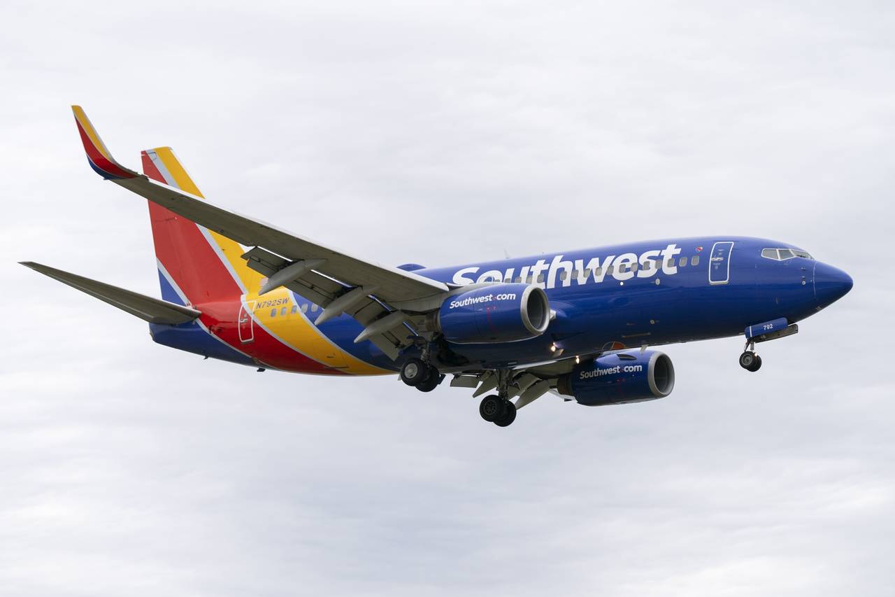 FILE - A Southwest Airlines flight prepares to land at Reagan National Airport, in Arlington, Va., ...