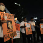 
              Activists holds posters against the impending execution of Nagaenthran K. Dharmalingam, sentenced to death for trafficking heroin into Singapore, during a candlelight vigil gathering outside the Singaporean Embassy in Kuala Lumpur, Malaysia, Tuesday, April 26, 2022. The Singapore Court of Appeal has dismissed a last-minute legal challenge filed by the mother of a mentally disabled Malaysian man in an attempt to halt his execution for drug trafficking. (AP Photo/Vincent Thian)
            