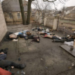 
              EDS NOTE: GRAPHIC CONTENT - Lifeless bodies of men, some with their hands tied behind their backs lie on the ground in Bucha, Ukraine, Sunday, April 3, 2022. Associated Press journalists in Bucha, a small city northwest of Kyiv, saw the bodies of at least nine people in civilian clothes who appeared to have been killed at close range. At least two had their hands tied behind their backs. (AP Photo/Vadim Ghirda)
            