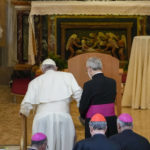 
              Pope Francis, is helped climbing the steps in front of the altar of the Virgina Mary of Ta'Pinu by his aide Monsignor Diego Ravelli, as they precede, from left, Malta's Archbishop Charles Jude Scicluna, Secretary General of the Synod of Bishops Cardinal Mario Grech, and Gozo's Bishop Antonio Teuma, right, inside the Ta' Pinu national sanctuary in Gharb on the Maltese island of Gozo, Saturday, April 2, 2022. Pope Francis headed to the Mediterranean island nation of Malta on Saturday for a pandemic-delayed weekend visit, aiming to draw attention to Europe's migration challenge that has only become more stark with Russia's invasion of Ukraine. (AP Photo/Andrew Medichini)
            