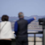 
              Visitors look at the North Korea side from the unification observatory in Paju, South Korea, Friday, April 15, 2022. North Korea is marking a key state anniversary Friday with calls for stronger loyalty to leader Kim Jong Un, but there was no word on an expected military parade to display new weapons amid heightened animosities with the United States. (AP Photo/Lee Jin-man)
            
