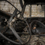 
              A pierced helmet sits inside a cabin of a Russian military truck, destroyed during fighting between Russian and Ukrainian forces, outside of Kyiv, Ukraine, Friday, April 1, 2022. Emergency relief and evacuation convoys for the besieged Ukrainian city of Mariupol remained in doubt Friday following reports of Russian interference, while Russian officials accused Ukraine of flying helicopter gunships across a border between the two countries and striking an oil depot.(AP Photo/Vadim Ghirda)
            