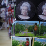 
              FILE - A souvenir shop selling memorabilia with pictures of Queen Elizbeth II, in Windsor, England Wednesday, April 21, 2021. Queen Elizabeth II is marking her 96th birthday privately on Thursday, April 21, 2022 retreating to the Sandringham estate in eastern England that has offered the monarch and her late husband, Prince Philip, a refuge from the affairs of state. (AP Photo/Kirsty Wigglesworth, File)
            