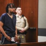 
              Marqel Cockrell enters court during an extradition hearing at the Regional Justice Center in Las Vegas, Thursday, April 14, 2022.   Police say Cockrell, a Southern California shoe store owner opened fire at two shoplifters but mistakenly shot a 9-year-old girl about to have her picture taken with a mall Easter bunny. He fled the state and was arrested in Nevada.(Rachel Aston/Las Vegas Review-Journal via AP)
            