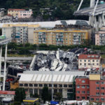 
              FILE - Cars are blocked on the Morandi highway bridge after a large section of it collapsed in Genoa, Italy, Aug. 14, 2018, during a sudden and violent storm. A judge in Genoa on Thursday, April 7, 2022 ordered all 59 defendants to stand trial for the deadly 2018 collapse of the Morandi highway bridge in the Italian port city. Forty-three people were killed when a large stretch of the Morandi Bridge broke off on the eve of one of Italy's biggest vacation holidays. (AP Photo/Antonio Calanni, File)
            