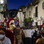 
              A statue of Jesus Christ is escorted by parishioners dressed as Roman soldiers during a Holy Week procession in Taxco, Mexico, Thursday, April 14, 2022. In traditional processions that last from Thursday evening into the early morning hours of Friday, hooded penitents drag chains and shoulder the thorny bundles through the streets, as some flog themselves with nail-studded whips meant to bring them closer to God. (AP Photo/Eduardo Verdugo)
            