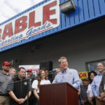 
              Gov. Brian Kemp speaks before he signed a bill, which will allow permitless carry, at a sporting goods store in Douglasville, Ga., Tuesday, April 12, 2022. The bill allows a "lawful weapons carrier" to carry a concealed handgun everywhere license holders currently are allowed. (Bob Andres/Atlanta Journal-Constitution via AP)
            