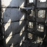 
              A view of an apartment building damaged by shelling in Kharkiv, Ukraine, Sunday, April 10, 2022. (AP Photo/Andrew Marienko)
            
