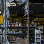 
              A liquor store owner looks at the damage to his shop caused by an explosion in Kyiv, Ukraine on Friday, April 29, 2022. Russia struck the Ukrainian capital of Kyiv shortly after a meeting between President Volodymyr Zelenskyy and U.N. Secretary-General António Guterres on Thursday evening. (AP Photo/Emilio Morenatti)
            
