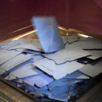 
              Ballots inside a box are pictured at a polling station in the first round of the French presidential election in Paris, Sunday, April 10, 2022. The polls opened at 8am in France for the first round of its presidential election where up to 48 million eligible French voters will be choosing between 12 candidates. (AP Photo/Michel Euler)
            