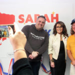 
              Former Alaska Gov. Sarah Palin, middle, poses for a photo with supporters at the opening of her new campaign headquarters in Anchorage, Alaska, on Wednesday, April 20, 2022. Palin, the first Republican female vice presidential nominee, is among 48 candidates running for the Alaska's lone seat in the U.S. House following the death last month of Republican Rep. Don Young, who held the job for 49 years. (AP Photo/Mark Thiessen)
            