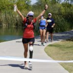 
              Jacky Hunt-Broersma finishes her 102nd marathon in 102 days, this one at Veterans Oasis Park, Thursday, April 28, 2022, in Chandler, Ariz. (AP Photo/Ross D. Franklin)
            