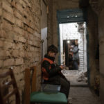 
              A child plays with a smartphone as he takes shelter inside the basement of a residential building during a Russian attack in Lyman, Ukraine, Tuesday, April 26, 2022. Russia pounded eastern and southern Ukraine on Tuesday as the U.S. promised to "keep moving heaven and earth" to get Kyiv the weapons it needs to repel the new offensive, despite Moscow's warnings that such support could trigger a wider war. (AP Photo/Leo Correa)
            