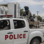 
              Police officers patrol the street during an anti-gang operation in Croix-des-Missions north of Port-au-Prince, Haiti, Thursday, April 28, 2022. (AP Photo/Odelyn Joseph)
            
