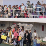 
              FILE - More than 2,000 Muslim and Croatian refugees arrive by ferry in the Croatian town of Rijeka, Croatia, Sunday, May 24, 1992 after fleeing the civil war in neighboring Bosnia-Herzegovina. Survivors of war crimes committed during Bosnia’s 1992-95 war say the victims of ongoing human rights abuses in Ukraine should learn from their experience of fighting for justice, but that they must first make peace with the fact that reaching it will inevitably be a lengthy and painful process. (AP Photo/Rudi Blaha, File)
            