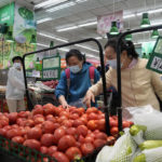 
              Residents wearing masks shop at a supermarket in the Chaoyang district of Beijing, Monday, April 25, 2022. Mass testing started Monday in Chaoyang district, home to more than 3 million people in the Chinese capital, following a fresh COVID-19 outbreak. (AP Photo/Ng Han Guan)
            