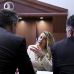 
              Actress Amber Heard talks to her attorneys in the courtroom at the Fairfax County Circuit Court in Fairfax, Va., Wednesday, April 20, 2022. Actor Johnny Depp sued his ex-wife Amber Heard for libel in Fairfax County Circuit Court after she wrote an op-ed piece in The Washington Post in 2018 referring to herself as a "public figure representing domestic abuse." (Evelyn Hockstein/Pool via AP)
            