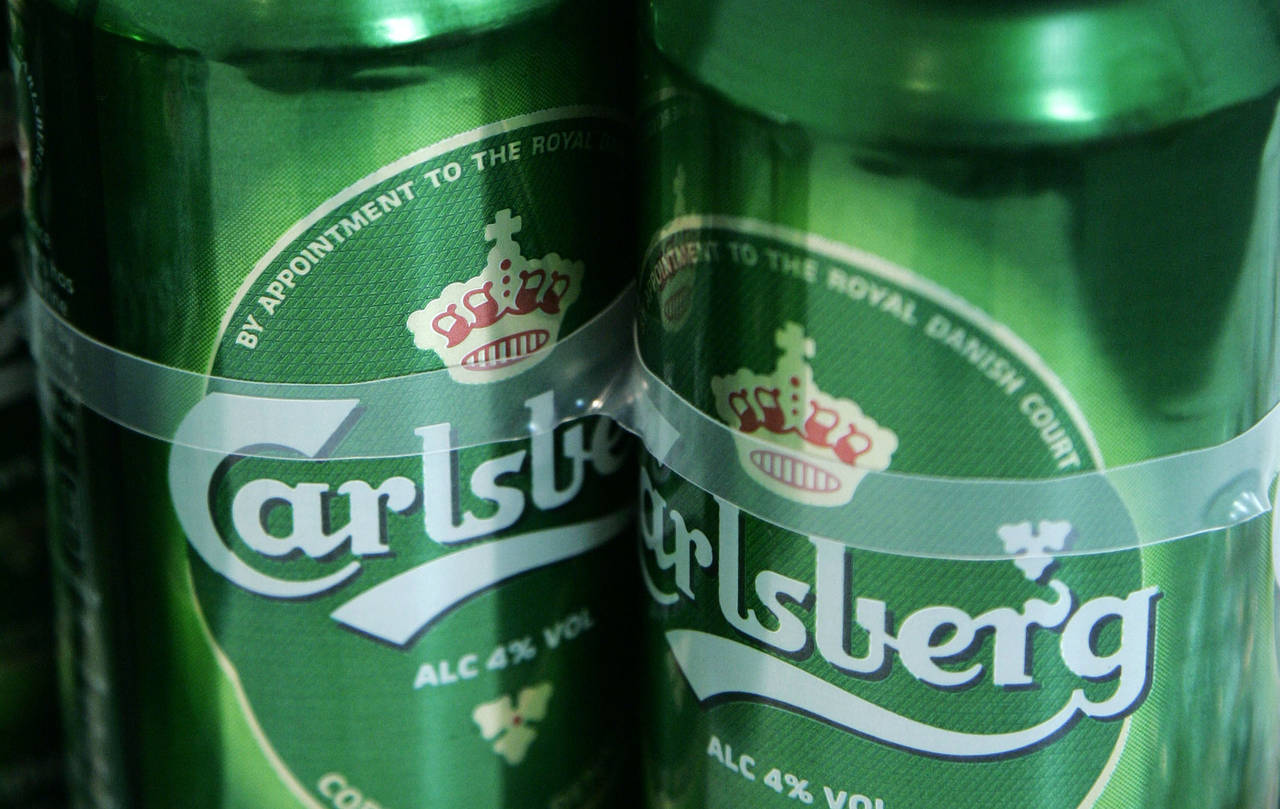 FILE - A view of Carlsberg beer cans at a joint press conference by Heineken and Carlsberg to annou...