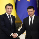 
              FILE - French President Emmanuel Macron, left, winks as he shakes hands with Ukrainian President Volodymyr Zelenskyy after a joint news conference following their talks in Kyiv, Ukraine, Tuesday, Feb. 8, 2022. As he begins a second term as France's president, Emmanuel Macron has given the green light for the delivery of artillery pieces to Ukraine. (AP Photo/Efrem Lukatsky, File)
            