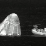 
              In this image from infrared video provided by SpaceX, recovery personnel approach the Dragon space capsule after splashdown in the Atlantic Ocean off the Florida coast on Monday, April 25, 2022. Three rich businessmen returned from the International Space Station with their astronaut escort, wrapping up a pricey trip that marked NASA’s debut as a B&B host. (SpaceX via AP)
            