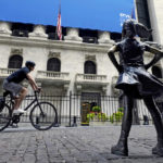 
              FILE - The Fearless Girl statue faces the New York Stock Exchange, Tuesday, July 20, 2021. Stocks shifted between small gains and losses in morning trading on Wall Street Thursday, April 7, 2022, as investors continue weighing the latest update from the Federal Reserve amid concerns about rising inflation.(AP Photo/Richard Drew, File)
            