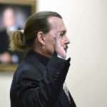 
              Actor Johnny Depp is sworn in during a hearing at the Fairfax County Circuit Court in Fairfax, Va., Tuesday April 19, 2022. Actor Johnny Depp sued his ex-wife Heard for libel in Fairfax County Circuit Court after she wrote an op-ed piece in The Washington Post in 2018 referring to herself as a "public figure representing domestic abuse." (Jim Watson/Pool Photo via AP)
            