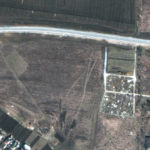 FILE - This satellite image provided by Maxar Technologies on Thursday, April 21, 2022 shows an overview of the cemetery in Manhush, some 20 kilometers west of Mariupol, Ukraine, on March 19, 2022. (Satellite image ©2022 Maxar Technologies via AP)