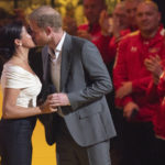 
              Prince Harry and Meghan Markle, Duke and Duchess of Sussex, kiss during the opening ceremony of the Invictus Games venue in The Hague, Netherlands, Saturday, April 16, 2022. The week-long games for active servicemen and veterans who are ill, injured or wounded opens Saturday in this Dutch city that calls itself the global center of peace and justice. (AP Photo/Peter Dejong)
            