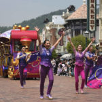 
              Dancers perform during a parade at the Hong Kong Disneyland, Thursday, April 21, 2022. Hong Kong Disneyland reopened to the public after shutting down due to a surge in COVID-19 infections. (AP Photo/Kin Cheung)
            