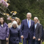 
              President Joe Biden walks with Sen. Maria Cantwell, D-Wash., left, and Sen. Patty Murray, D-Wash., as they arrive at Seward Park on Earth Day, Friday, April 22, 2022, in Seattle. Rep. Rick Larsen, D-Wash., is at right. (AP Photo/Andrew Harnik)
            