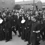 
              FILE - Six Catholic nuns, including Sister Mary Antona Ebo, front row fourth from left, lead a march in Selma, Ala., on March 10, 1965, in support of Black voting rights and in protest of the violence of Bloody Sunday when white state troopers brutally dispersed peaceful Black demonstrators. The group was within a hundred feet of a black church when the police blocked their way. (AP Photo/File)
            