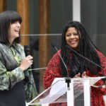 
              American sculptor Simone Leigh, right, and curator Eva Respini attend a press conference during the unveiling of the United States' pavilion at the 59th Biennale of Arts exhibition in Venice, Italy, Thursday, April 21, 2022. The first Black woman to headline the U.S. Pavilion, Leigh has posted the monumental 24-foot sculpture called "Satellite" outside the neo-Palladian brick structure, which is hidden beneath a thatched raffia roof and wooden columns. (AP Photo/Luigi Costantini)
            
