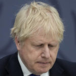 
              FILE - British Prime Minister Boris Johnson delivers a speech at Lydd Airport, south east England, Thursday, April 14, 2022.  Johnson is facing British lawmakers for the first time since he was fined by police for attending a birthday party in his office that broke coronavirus lockdown rules. As the House of Commons returns Tuesday, April 19, 2022 from an 11-day Easter break, Johnson is expected to apologize for what he insists was a minor slip-up.  (AP Photo/Matt Dunham, Pool, File)
            