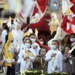 
              Children cheer as they wait for Pope Francis at the Basilica of St Paul in Rabat, Malta, Sunday, April 3, 2022. Francis was opening his second and final day in Malta on Sunday by visiting the Grotto of St. Paul in Rabat, where the disciple stayed after being shipwrecked en route to Rome in AD 60. (AP Photo/Rene Rossignaud)
            