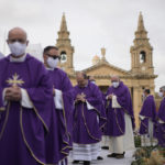 
              Priests arrive at the Granaries in Floriana, Malta, Sunday, April 3, 2022, to attend a mass with Pope Francis. Pope Francis opened his second and final day in Malta by visiting the Grotto of St. Paul in Rabat, where the disciple stayed after being shipwrecked en route to Rome in AD 60. According to the biblical account of the period, Maltese people showed Paul unusual kindness, and he responded by preaching and healing, bringing Christianity to the islands. (AP Photo/Andrew Medichini)
            